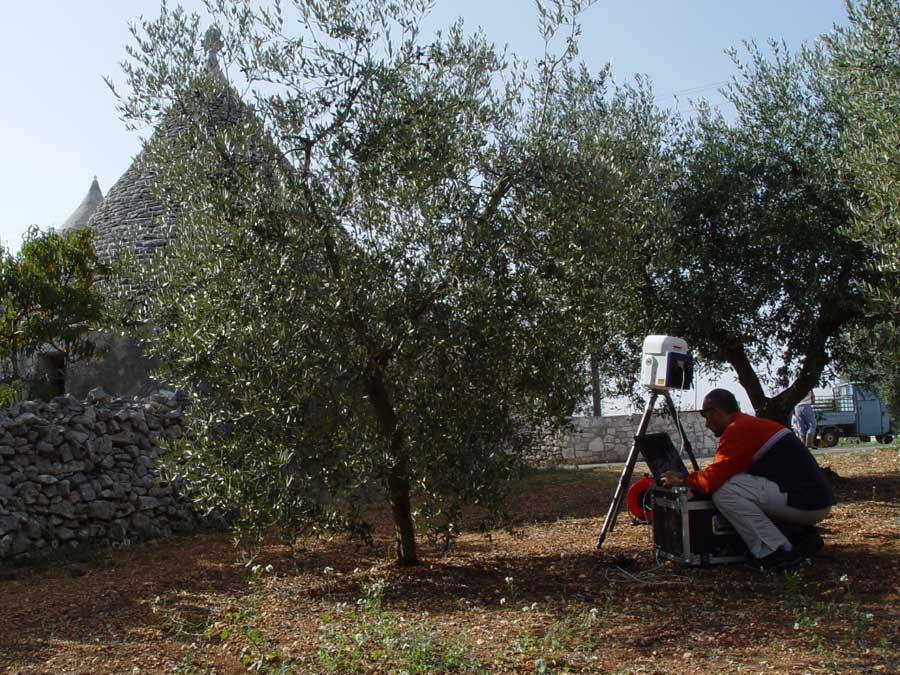 A terrestrial laser scanner surveying a built environment.